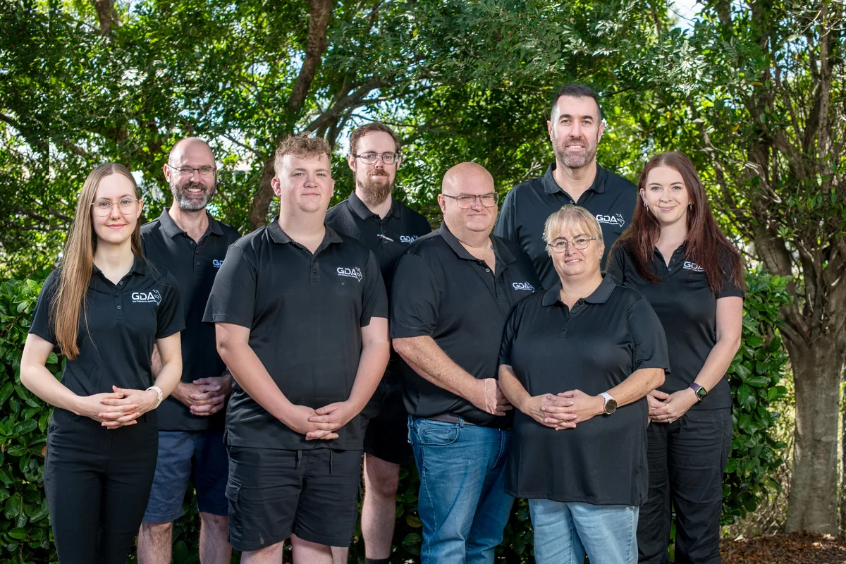 The Gas Detection Australia team standing together outdoors in branded polo shirts