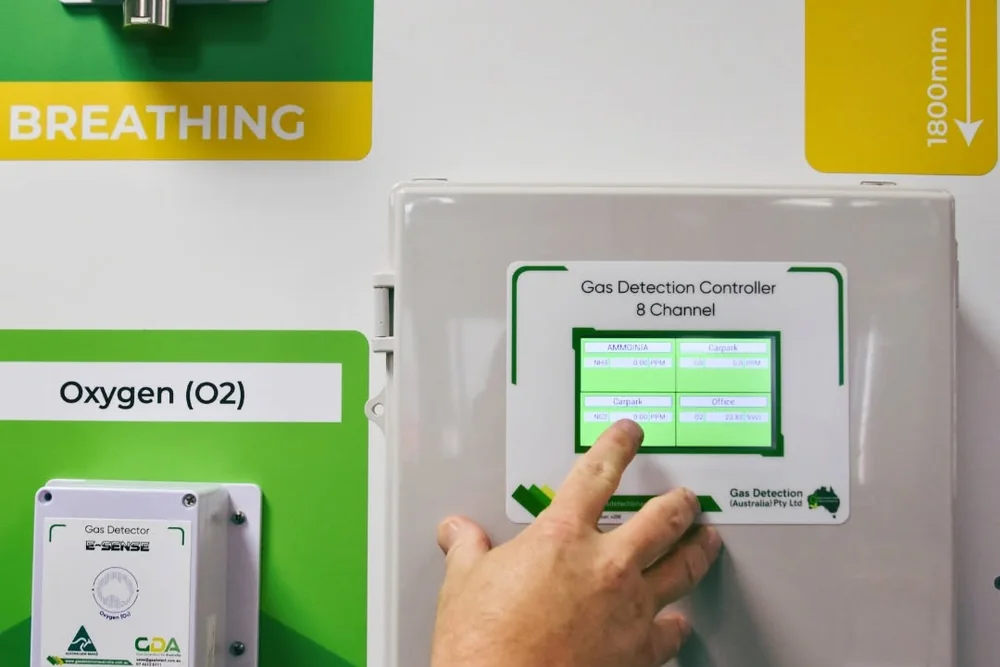 A Gas Detection Australia 8-channel gas detection controller being operated on a detector display wall